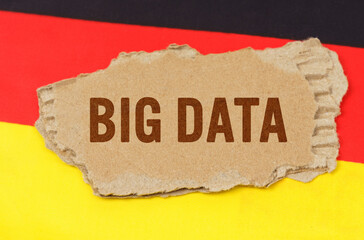 Against the background of the German flag lies cardboard with the inscription - BIG DATA