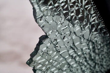 A Shattered Side Window of a Broken Car