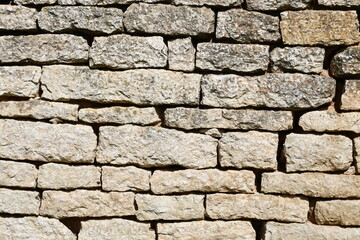 Ancient stone hay made of white stone. Roughly finished brick. 