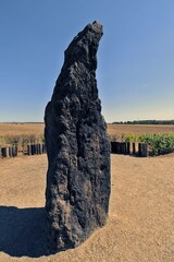 Menhir named Stone Shepherd standing alone in a field 1 km from the village Klobuky in the Czech Republic.