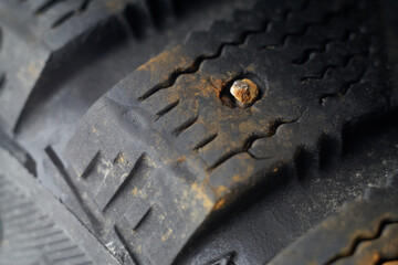 An Old Worn Winter Tyre of an Old Car