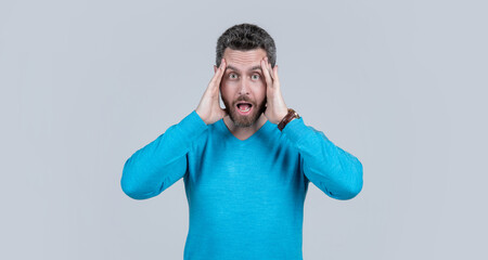 amazed unshaven guy with bristle and moustache. tired and stressed mature guy has headache.