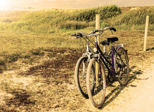 Two bicycles in countryside. Brittany, France. The concept of romance, love and simple everyday life. Aged photo.