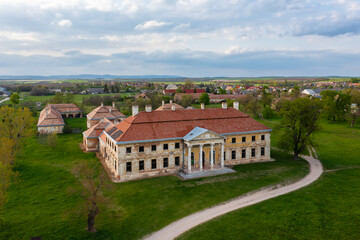 Naklejka na ściany i meble Aerial view about abandoned Cziraky Castle with cloudy sky at the background.