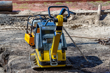 Samara, Russia - May 06, 2021: Vibration plate sealer on a construction site in sunny weather.