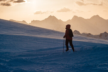 silhouette of alpinist climber man in red jacket in mountains. Elbrus Mountain