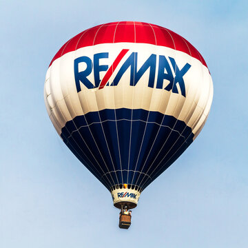 RE/MAX hot air balloon flame on isolated on blue sky room for text