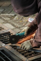 worker cutting steel
