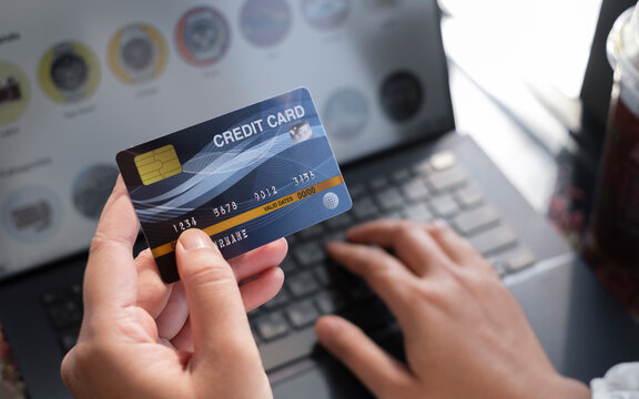 woman holding credit card and use laptop for with shopping online. Online payment concept. - Image