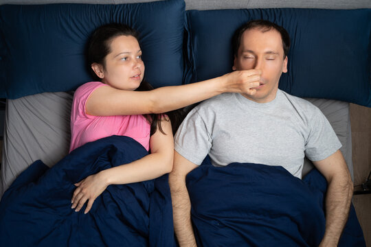 Woman Trying To Stop Snoring