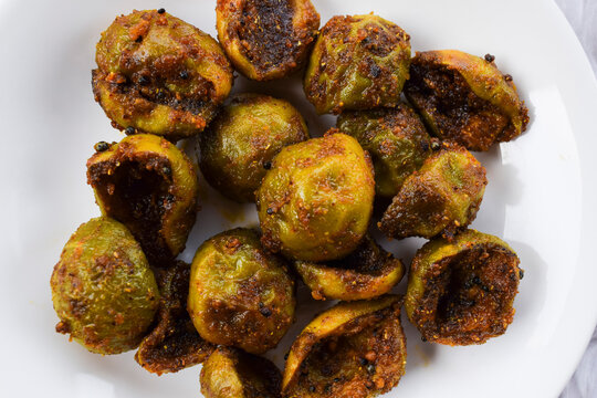Tasty Goonda or Gunde ki sabzi also known as Gumberry or glue berry vegetable home cooked with Indian masala. Seasonal sabji fruit side dish eaten with chapati or rice. Also known as Lasoda or lasura
