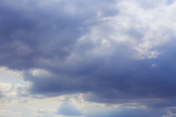 Naklejka na ściany i meble Cumulus clouds. Beautiful dark blue dramatic sky. Free space for lettering.