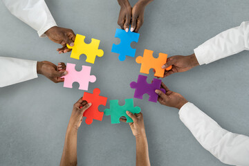 African Medical Doctors Holding Puzzle Together