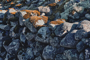 Old stone fence along Byvegen Road, Toten, Norway.