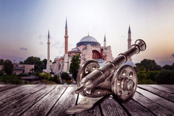 Ramadan Concept - Hagia Sophia Mosque  with Black a cannon in the foreground at twilight blue hour...