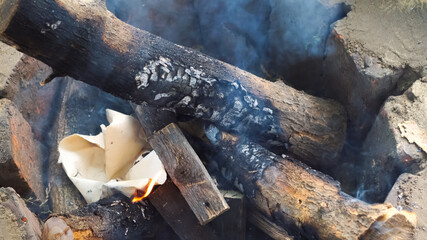 Bonfire close-up, burning firewood. Camping and fire safety concept