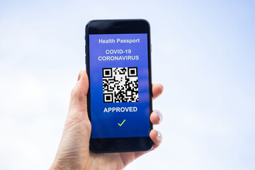 health Vaccine Passport for Coronavirus or Covid-19. Traveller Using Mobile Phone with Vaccination in Immune Status to Certificated International Traveling in Airport