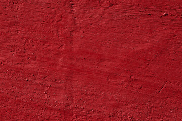 Fototapeta premium Texture of the red stucco wall with scratches, cracks, dust, crevices, roughness. Can be used as a poster or background for design.