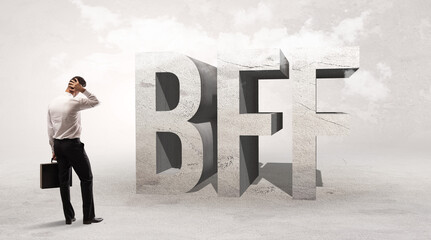 Rear view of a businessman standing in front of abbreviation