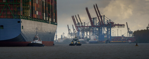 Large container ship arrives in the port of hamburg 