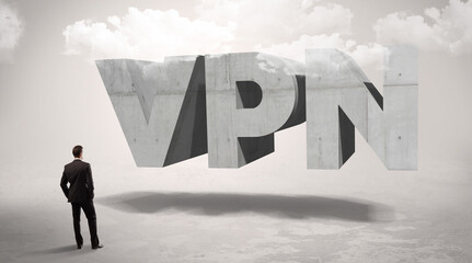 Obraz premium Rear view of a businessman standing in front abbreviation