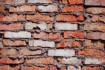 Old grungy brick wall with natural defects. Scratches, cracks, crevices, chips, dust, roughness. Can be used as background for design or poster.