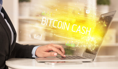 Closeup of businessman hands working on laptop