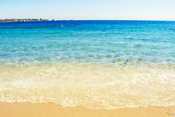 Egypt, Safaga, Red Sea coast, waves, blue lagoon, white sand, sunny day, vacation by the sea.