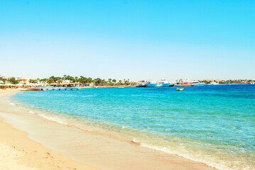 Fototapeta na wymiar Egypt, Safaga, Red Sea coast, waves, blue lagoon, white sand, sunny day, vacation by the sea.