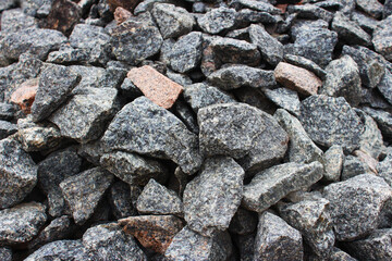 Mountain of rubble close up. Used for mixing mortar in construction, pouring concrete slabs, casting columns, decorating houses, and gardens.