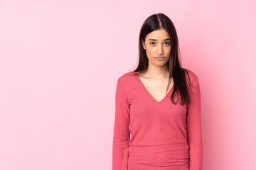 Young caucasian woman over isolated background with sad expression