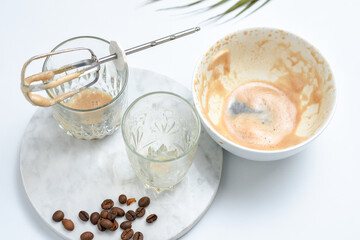 The making of Dalgona South Korean Coffee.Iced Dalgona Coffee, a trendy fluffy creamy whipped coffee