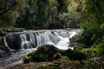 A beautiful waterfall found at Paraibuna river hiking trail. This is one of many cascades of the river that runs in the middle of Serra do Mar (Sea Ridge) dense jungle in Cunha, Sao Paulo - Brazil.