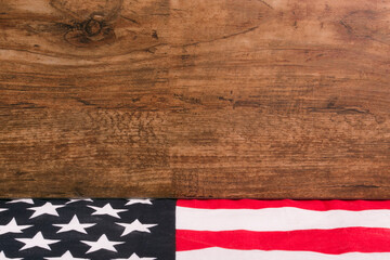 American flag on wooden background, with place for text