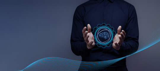 businessman holds a hologram of an artificial intelligence brain. concept of futuristic...