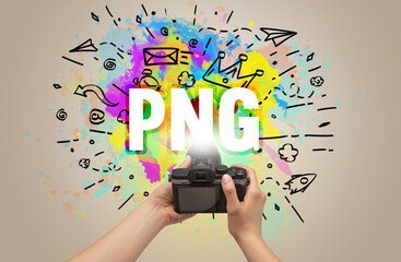 Close-up of a hand holding digital camera with abstract drawing