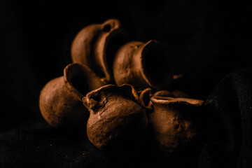 Pre-Columbian vessels on a black background