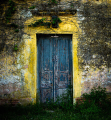 Old abandoned wooden blue door