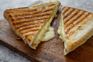 Close up of sandwich with grilled white bread and cheese
