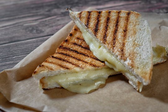 Close Up Of Sandwich With Grilled White Bread And Cheese