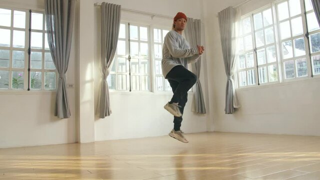Asian Man Dancing At Home
