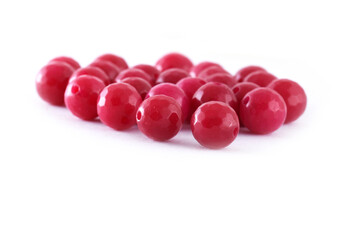 Red Beads spread on white background. Background or texture of beads.Close up,used in finishing fashion clothes. make bead necklace or string of beads for women of fashion,Bead Crochet. Daily Beading.