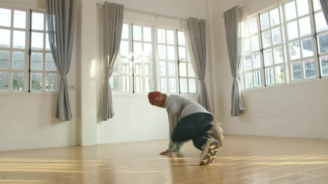 Male Break Dancer Dancing In Home
