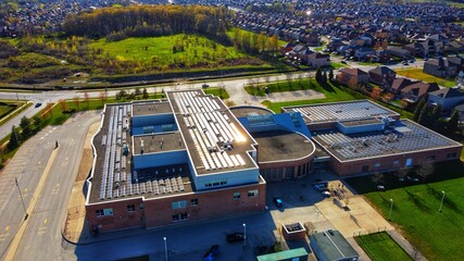 School in Ontario with solar system on its roof © KissCat