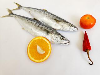 Fresh Seer Fish,King Fish decorated with herbs and vegetables .isolated on white background,selective focus.