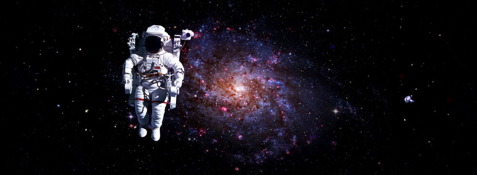 Astronaut spaceman do spacewalk while working for space station in outer space . Astronaut wear full spacesuit for space operation . Elements of this image furnished by NASA space astronaut photos.