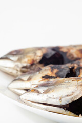 a grilled scad fish isolated on white background