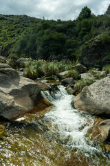 small beautiful waterfall among the rocks