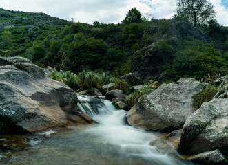 small waterfall in a mountain river