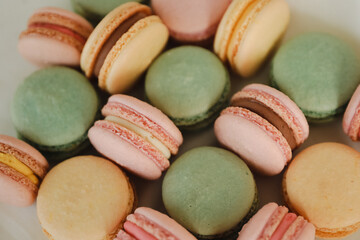 French macaroon assortment in pastel colours. Pastry background.